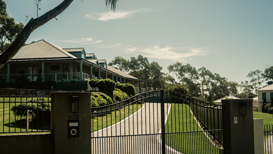 Black aluminum driveway gate at a Florida home
