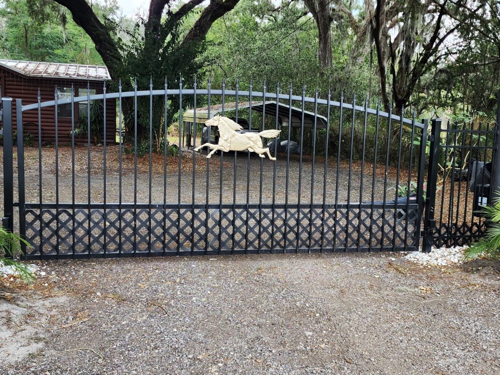 Arched Gate with Custom Horse Accent installed by KSM Gates in the Tampa Bay area