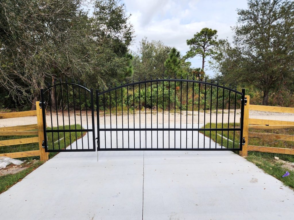 Arched Gate Matched to Wood Fence installed by KSM Gates in the Tampa Bay area