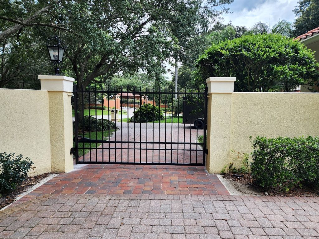 Courtyard Entry Gate with Stucco Walls installed by KSM Gates in the Tampa Bay area